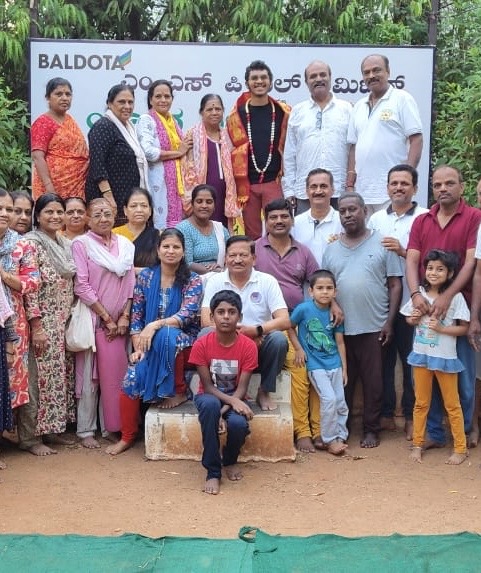 Community group gathering with banner