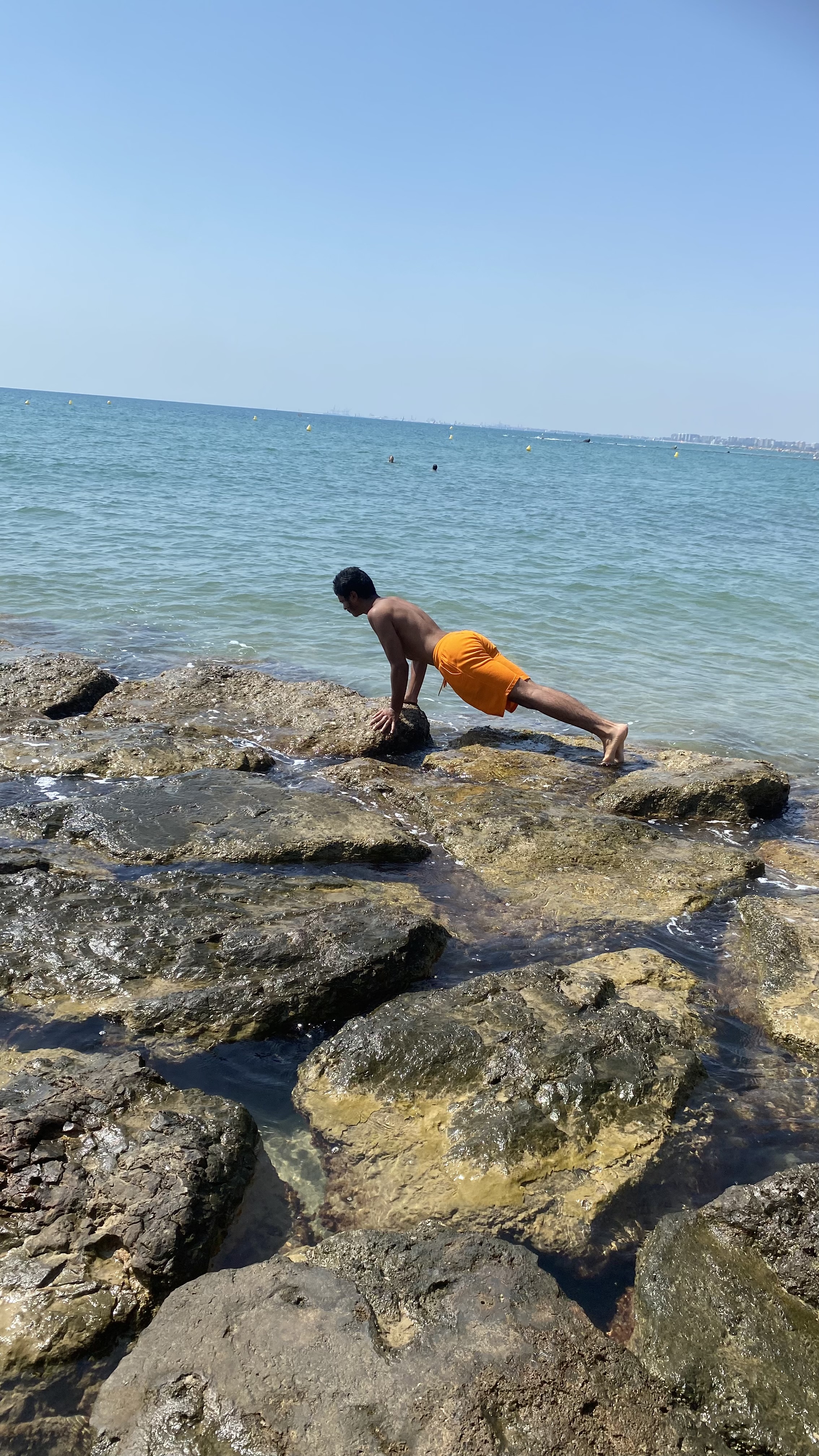 Doing pushups by the ocean